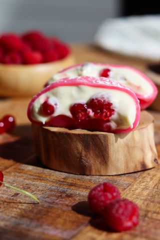 Mochi with cream,raspberries and rad currants-raspberry color