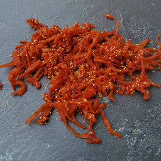 Кальмар В Кунжуті (100г.)