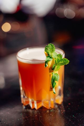 The Manhattan is a classic cocktail made with whiskey, sweet vermouth, and bitters. It is typically garnished with a cherry or a twist of lemon. The drink is known for its smooth, rich flavor and is a popular choice in bars and restaurants.