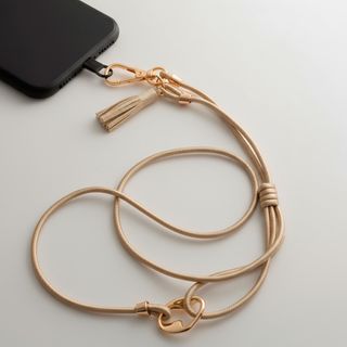 Colgante Nudo Cuero Dorado para tu Móvil