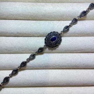 Srebrena narukvica plavi ovalni krug i markizit