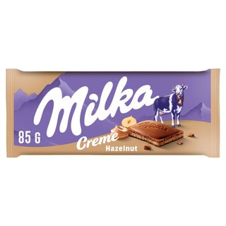 Milka Creme Czekolada mleczna z nadzieniem z orzechów laskowych 85 g