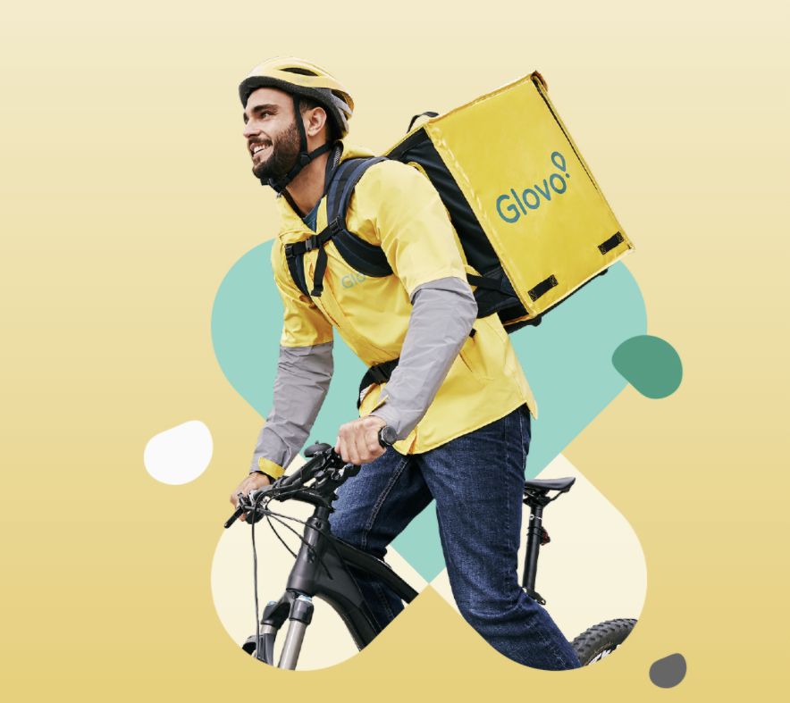 A Glovo courier on his bike