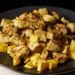 Raxo con patatas