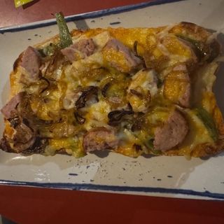 Torrada de butifarra gratinada