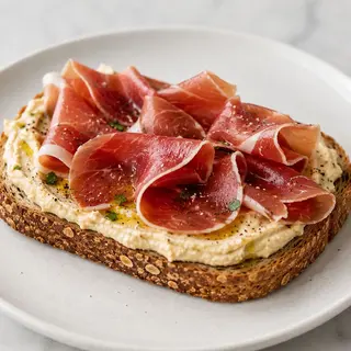 Tostada + Hummus + Jamón Serrano