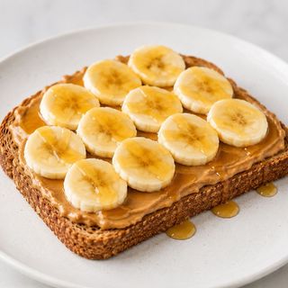 Tostada De Crema De Cacahuete + Plátano Y Miel