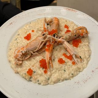 Risotto carnaroli scrampi, champagne e uova di salmone