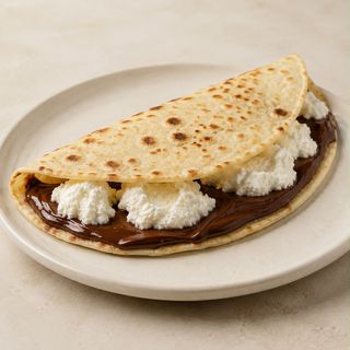 Crema di nocciole fondente nellina fondente e ricotta di pecora locale