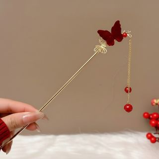 Zlatna ukosnica sa motivom dvostrukog leptira i visećim perlama